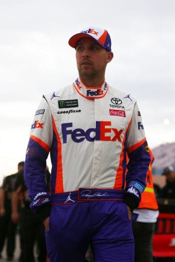 LAS VEGAS, NV - MARCH 01: Denny Hamlin, driver of the #11 FedEx Office Toyota, walks on the grid during qualifying for the Monster Energy NASCAR Cup Series Pennzoil 400 at Las Vegas Motor Speedway on March 1, 2019 in Las Vegas, Nevada.  (Photo by Sarah Crabill/Getty Images) | Getty Images