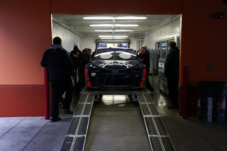 LAS VEGAS, NV - MARCH 02: The #88 Axalta Chevrolet is inspected during a rain delayed practice for the Monster Energy NASCAR Cup Series Pennzoil 400 at Las Vegas Motor Speedway on March 2, 2019 in Las Vegas, Nevada.  (Photo by Sarah Crabill/Getty Images) | Getty Images