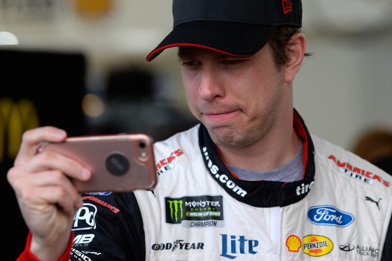 LAS VEGAS, NV - MARCH 02: Brad Keselowski, driver of the #2 Discount Tire Ford, records a message on a phone during practice for the Monster Energy NASCAR Cup Series Pennzoil 400 at Las Vegas Motor Speedway on March 2, 2019 in Las Vegas, Nevada. (Photo by Robert Laberge/Getty Images) | Getty Images