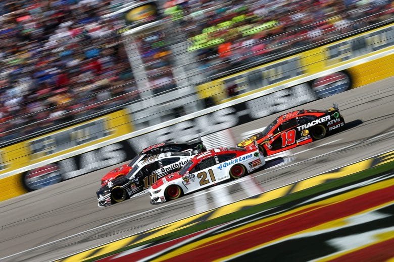 LAS VEGAS, NV - MARCH 03: Aric Almirola, driver of the #10 Smithfield Ford, leads Paul Menard, driver of the #21 Motorcraft/Quick Lane Tire & Auto Center Ford, and Martin Truex Jr., driver of the #19 Bass Pro Shops Toyota, during the Monster Energy NASCAR Cup Series Pennzoil Oil 400 at Las Vegas Motor Speedway on March 3, 2019 in Las Vegas, Nevada.  (Photo by Sarah Crabill/Getty Images) | Getty Images