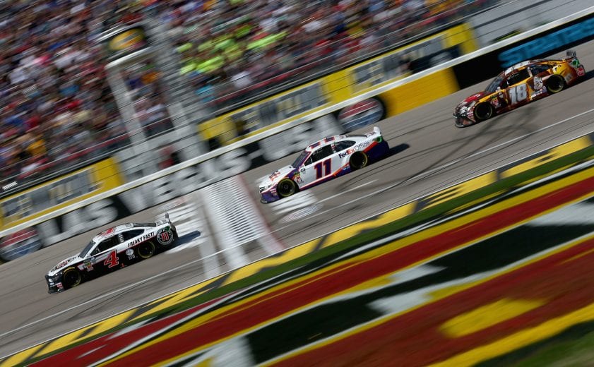 LAS VEGAS, NV - MARCH 03:  Kevin Harvick, driver of the #4 Jimmy John's Ford, and Denny Hamlin, driver of the #11 FedEx Office Toyota, lead the field to green for the start of the Monster Energy NASCAR Cup Series Pennzoil Oil 400 at Las Vegas Motor Speedway on March 3, 2019 in Las Vegas, Nevada.  (Photo by Sarah Crabill/Getty Images) | Getty Images