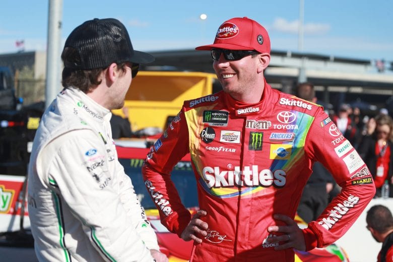 AVONDALE, AZ - MARCH 08: Kyle Busch, driver of the #18 Skittles Toyota, talks with Ryan Blaney, driver of the #12 MoneyLion Ford, during qualifying for the Monster Energy NASCAR Cup Series TicketGuardian 500 at ISM Raceway on March 8, 2019 in Avondale, Arizona. (Photo by Matt Sullivan/Getty Images) | Getty Images