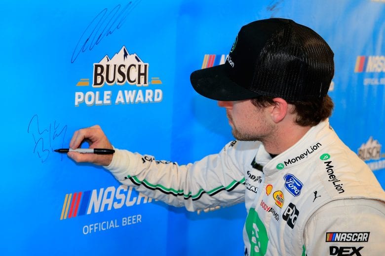 AVONDALE, AZ - MARCH 08:  Ryan Blaney, driver of the #12 MoneyLion Ford, signs the Busch Pole Award backdrop after qualifying for the pole position for the Monster Energy NASCAR Cup Series TicketGuardian 500 at ISM Raceway on March 8, 2019 in Avondale, Arizona.  (Photo by Daniel Shirey/Getty Images) | Getty Images