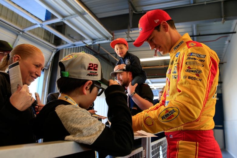 AVONDALE, AZ - MARCH 09:  Joey Logano, driver of the #22 Shell Pennzoil Ford, signs autographs for fans during practice for the Monster Energy NASCAR Cup Series TicketGuardian 500 at ISM Raceway on March 9, 2019 in Avondale, Arizona.  (Photo by Daniel Shirey/Getty Images) | Getty Images