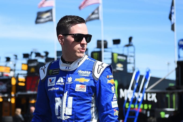 AVONDALE, AZ - MARCH 09:  Alex Bowman, driver of the #88 Nationwide Chevrolet, walks throguh the garage area during practice for the Monster Energy NASCAR Cup Series TicketGuardian 500 at ISM Raceway on March 9, 2019 in Avondale, Arizona.  (Photo by Stacy Revere/Getty Images) | Getty Images