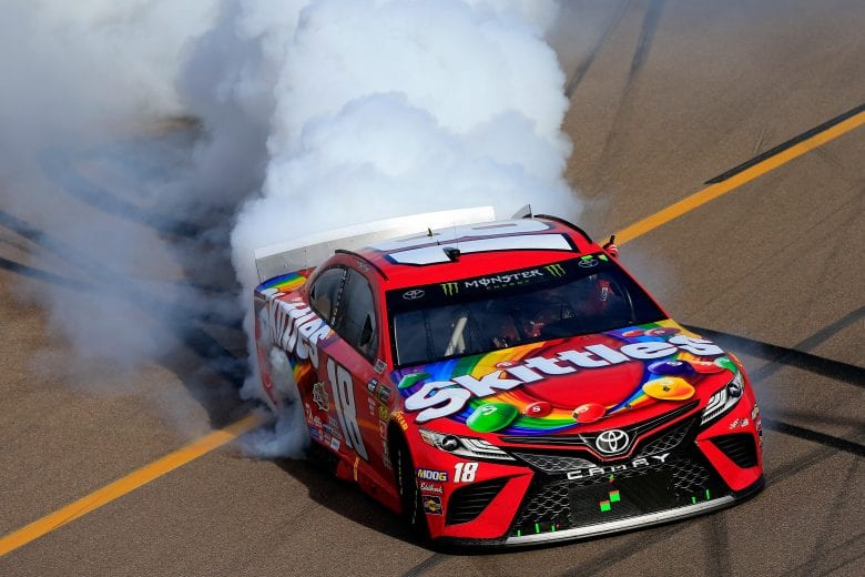 AVONDALE, AZ - MARCH 10:  Kyle Busch, driver of the #18 Skittles Toyota, celebrates with a burnout after winning the Monster Energy NASCAR Cup Series TicketGuardian 500 at ISM Raceway on March 10, 2019 in Avondale, Arizona.  (Photo by Daniel Shirey/Getty Images) | Getty Images