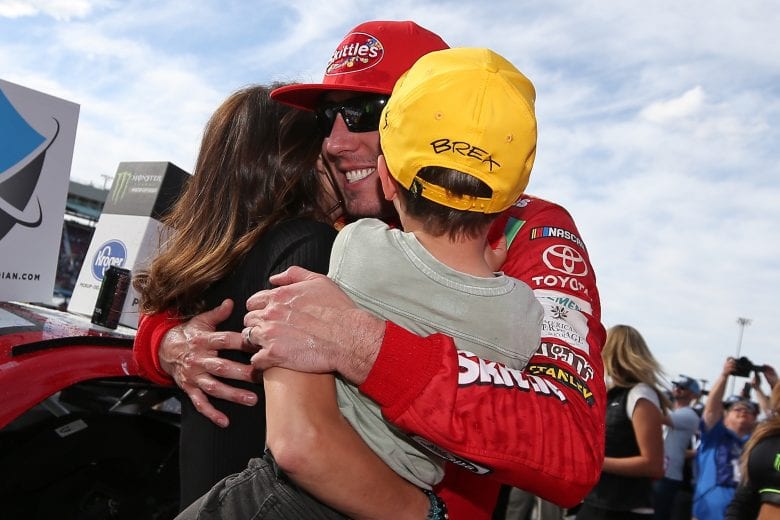 AVONDALE, AZ - MARCH 10:  Kyle Busch, driver of the #18 Skittles Toyota, celebrates with his wife, Samantha, and son, Brexton, after winning the Monster Energy NASCAR Cup Series TicketGuardian 500 at ISM Raceway on March 10, 2019 in Avondale, Arizona.  (Photo by Matt Sullivan/Getty Images) | Getty Images