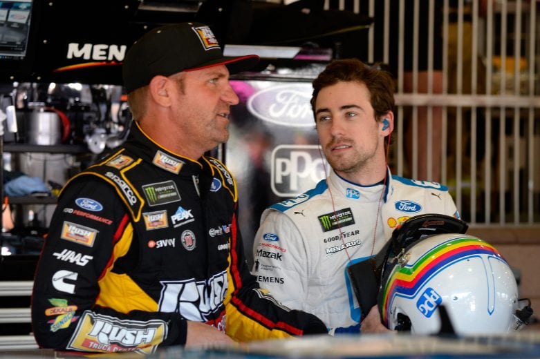 FONTANA, CA - MARCH 16: Clint Bowyer, driver of the #14 Rush Truck Centers/Haas Automation Ford, talks to Ryan Blaney, driver of the #12 PPG Ford, during practice for the Monster Energy NASCAR Cup Series Auto Club 400 at Auto Club Speedway on March 16, 2019 in Fontana, California. (Photo by Robert Laberge/Getty Images) | Getty Images