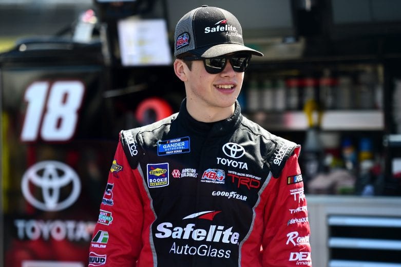 MARTINSVILLE, VA - MARCH 22:  Harrison Burton, driver of the #18 Safelite AutoGlass Toyota, stands in the garage area during practice for the NASCAR Gander Outdoors Truck Series TruNorth Global 250 at Martinsville Speedway on March 22, 2019 in Martinsville, Virginia.  (Photo by Jared C. Tilton/Getty Images) | Getty Images