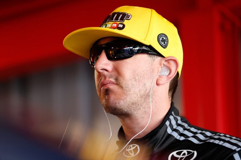 MARTINSVILLE, VA - MARCH 23:  Kyle Busch, driver of the #18 M&M's Chocolate Bar Toyota, stands in the garage area during practice for the Monster Energy NASCAR Cup Series STP 500 at Martinsville Speedway on March 23, 2019 in Martinsville, Virginia.  (Photo by Brian Lawdermilk/Getty Images) | Getty Images