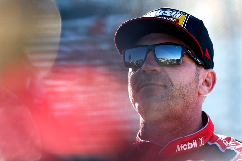 MARTINSVILLE, VA - MARCH 23:  Clint Bowyer, driver of the #14 Mobil 1/Rush Truck Centers Ford, stands on the grid during qualifying for the Monster Energy NASCAR Cup Series STP 500 at Martinsville Speedway on March 23, 2019 in Martinsville, Virginia.  (Photo by Brian Lawdermilk/Getty Images) | Getty Images