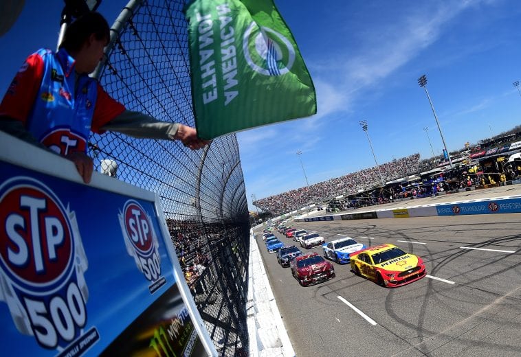 MARTINSVILLE, VA - MARCH 24:  Joey Logano, driver of the #22 Shell Pennzoil Ford, and Aric Almirola, driver of the #10 SHAZAMSmithfield Ford, lead the field to the green flag to start the Monster Energy NASCAR Cup Series STP 500 at Martinsville Speedway on March 24, 2019 in Martinsville, Virginia.  (Photo by Jared C. Tilton/Getty Images) | Getty Images
