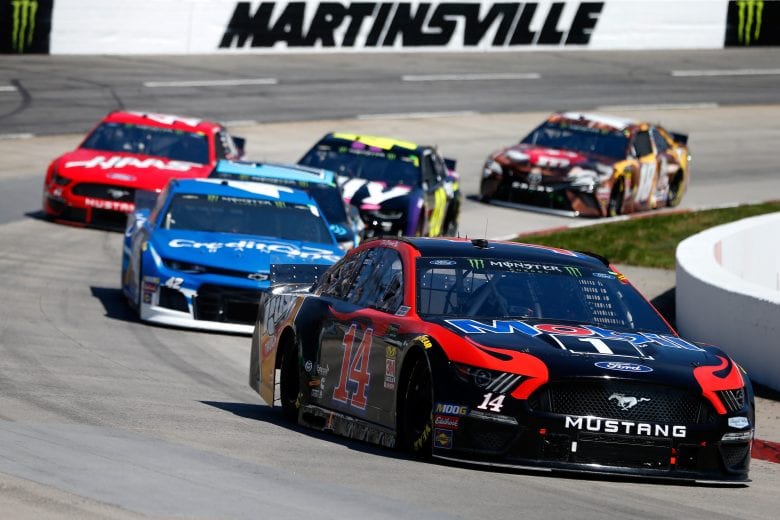 MARTINSVILLE, VA - MARCH 24:  Clint Bowyer, driver of the #14 Mobil 1/Rush Truck Centers Ford, leads a pack of cars during the Monster Energy NASCAR Cup Series STP 500 at Martinsville Speedway on March 24, 2019 in Martinsville, Virginia.  (Photo by Brian Lawdermilk/Getty Images) | Getty Images