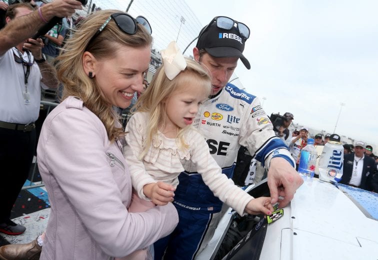 MARTINSVILLE, VA - MARCH 24:  Brad Keselowski, driver of the #2 Reese/Draw Tite Ford, celebrates with his wife Paige and their daughter Scarlett in Victory Lane after winning the Monster Energy NASCAR Cup Series STP 500 at Martinsville Speedway on March 24, 2019 in Martinsville, Virginia.  (Photo by Brian Lawdermilk/Getty Images) | Getty Images
