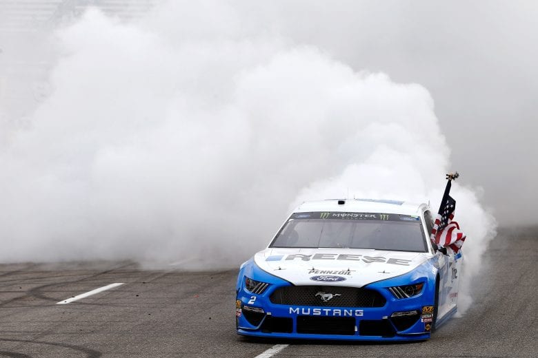 MARTINSVILLE, VA - MARCH 24:  Brad Keselowski, driver of the #2 Reese/Draw Tite Ford, celebrates with a burnout after winning the Monster Energy NASCAR Cup Series STP 500 at Martinsville Speedway on March 24, 2019 in Martinsville, Virginia.  (Photo by Brian Lawdermilk/Getty Images) | Getty Images