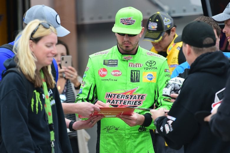 FORT WORTH, TX - MARCH 29: Kyle Busch, driver of the #18 Interstate Batteries Toyota, signs autographs during practice for the Monster Energy NASCAR Cup Series O'Reilly Auto Parts 500 at Texas Motor Speedway on March 29, 2019 in Fort Worth, Texas. (Photo by Jared C. Tilton/Getty Images) | Getty Images