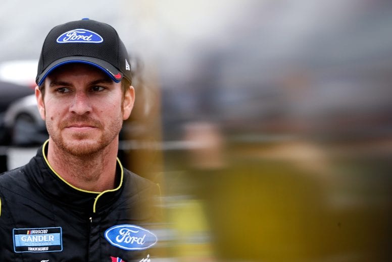 FORT WORTH, TX - MARCH 29: Grant Enfinger, driver of the #98 Champion Power Equipment/Curb Records Ford, stands by his truck during qualifying for the NASCAR Gander Outdoors Truck Series Vankor 350 at Texas Motor Speedway on March 29, 2019 in Fort Worth, Texas. (Photo by Brian Lawdermilk/Getty Images) | Getty Images