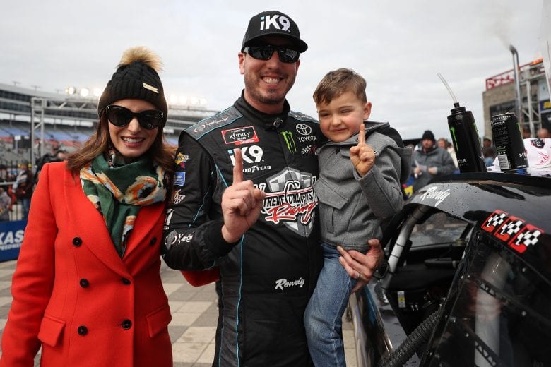 FORT WORTH, TX - MARCH 30: Kyle Busch, driver of the #18 iK9 Toyota, celebrates with his son Brexton and wife Samantha by placing the Winner's sticker on his car after winning the NASCAR Xfinity Series My Bariatric Solutions 300 at Texas Motor Speedway on March 30, 2019 in Fort Worth, Texas. (Photo by Chris Graythen/Getty Images) | Getty Images
