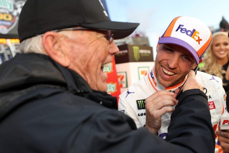 FORT WORTH, TX - MARCH 31: Team owner Joe Gibbs celebrates with Denny Hamlin, driver of the #11 FedEx Office Toyota, after winning the Monster Energy NASCAR Cup Series O'Reilly Auto Parts 500 at Texas Motor Speedway on March 31, 2019 in Fort Worth, Texas. (Photo by Chris Graythen/Getty Images) | Getty Images