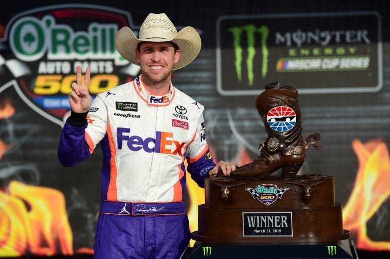 FORT WORTH, TX - MARCH 31: Denny Hamlin, driver of the #11 FedEx Office Toyota, poses with the trophy after winning the Monster Energy NASCAR Cup Series O'Reilly Auto Parts 500 at Texas Motor Speedway on March 31, 2019 in Fort Worth, Texas. (Photo by Jared C. Tilton/Getty Images) | Getty Images