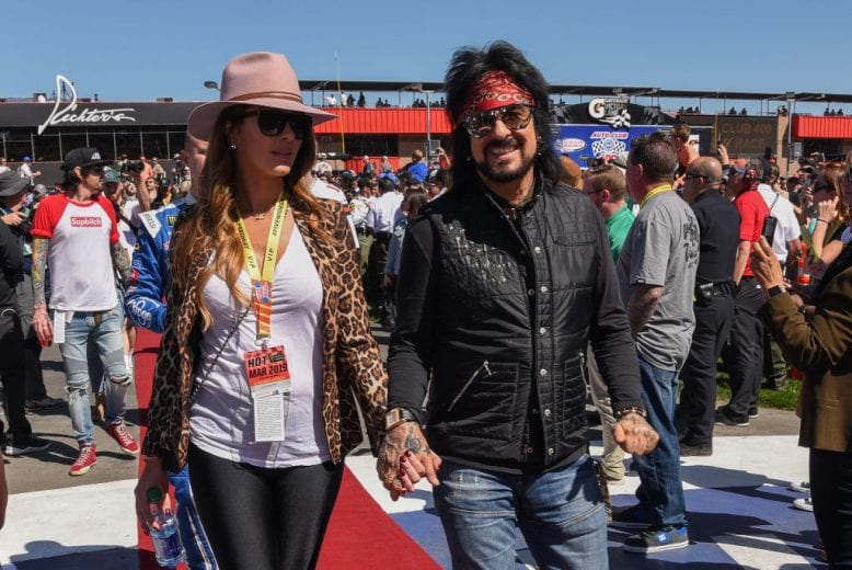 FONTANA, CA - MARCH 17: Courtney Sixx and Nikki Sixx attend the Monster Energy NASCAR Cup Series race at Auto Club Speedway at Auto Club Speedway on March 17, 2019 in Fontana, California. (Photo by Presley Ann/Getty Images) | Getty Images
