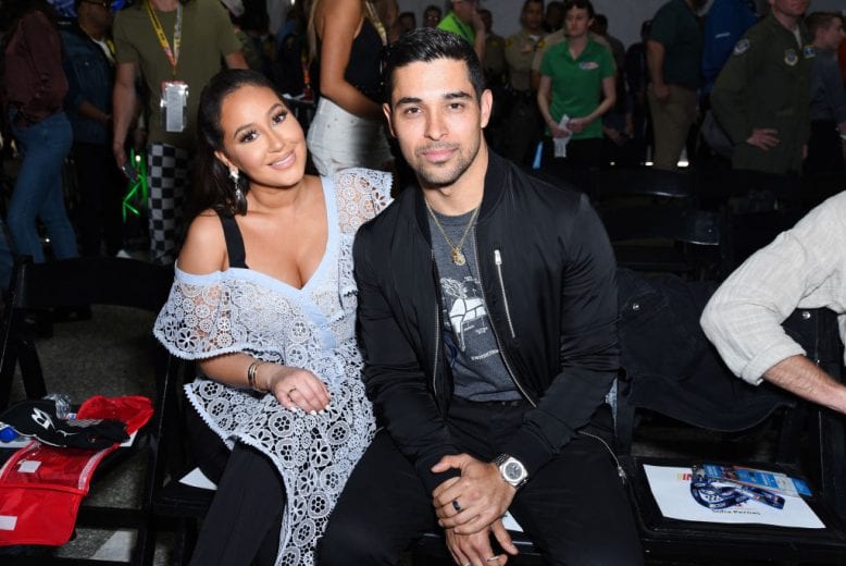FONTANA, CA - MARCH 17: Adrienne Bailon and Wilmer Valderrama attend the Monster Energy NASCAR Cup Series race at Auto Club Speedway at Auto Club Speedway on March 17, 2019 in Fontana, California. (Photo by Presley Ann/Getty Images) | Getty Images