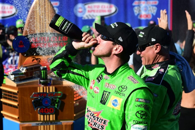 FONTANA, CALIFORNIA - MARCH 17: Kyle Busch, driver of the #18 Interstate Batteries Toyota, celebrates in victory lane after winning the Monster Energy NASCAR Cup Series Auto Club 400 and winning his 200th NASCAR race at Auto Club Speedway on March 17, 2019 in Fontana, California. (Photo by Jared C. Tilton/Getty Images) | Getty Images
