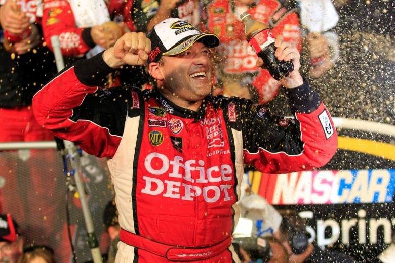 HOMESTEAD, FL - NOVEMBER 20:  Tony Stewart, driver of the #14 Office Depot/Mobil 1 Chevrolet, celebrates in Victory Lane after winning the NASCAR Sprint Cup Series Ford 400 and the 2011 Series Championship at Homestead-Miami Speedway on November 20, 2011 in Homestead, Florida. Stewart wins his third NASCAR Championship.  (Photo by Chris Trotman/Getty Images for NASCAR) | Getty Images