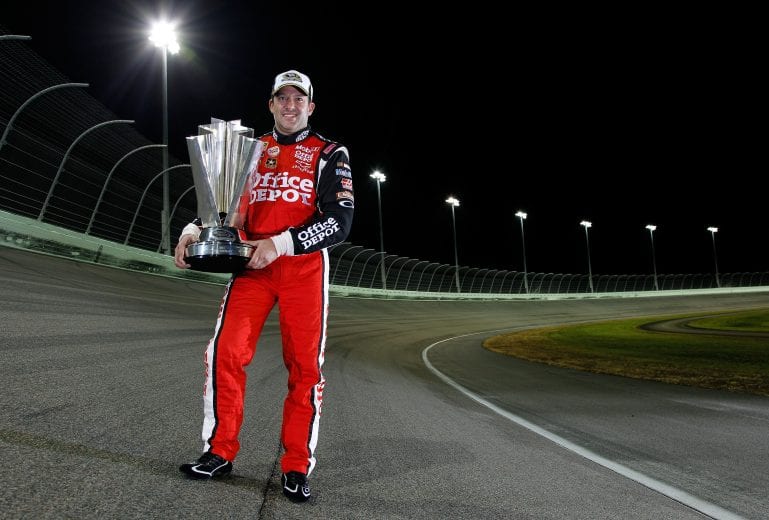 HOMESTEAD, FL - NOVEMBER 21:  Tony Stewart, driver of the #14 Office Depot/Mobil 1 Chevrolet, poses with the Championship trophy after winning the NASCAR Sprint Cup Series Ford 400 and the 2011 Series Championship at Homestead-Miami Speedway on November 21, 2011 in Homestead, Florida.  (Photo by Chris Graythen/Getty Images) | Getty Images
