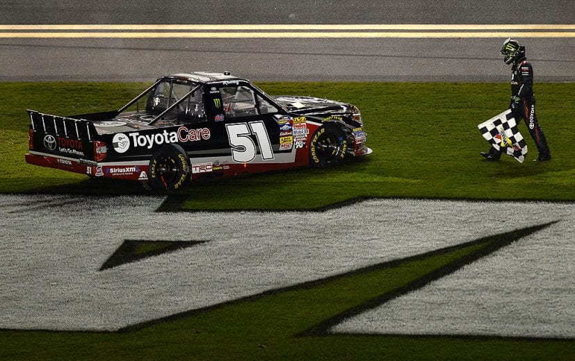 DAYTONA BEACH, FL - FEBRUARY 21: Kyle Busch, driver of the #51 ToyotaCare Toyota, celebrates with the checkered flag after winning the Camping World Truck Series NextEra Energy Resources 250 at Daytona International Speedway on February 21, 2014 in Daytona Beach, Florida. (Photo by Jared C. Tilton/Getty Images) | Getty Images