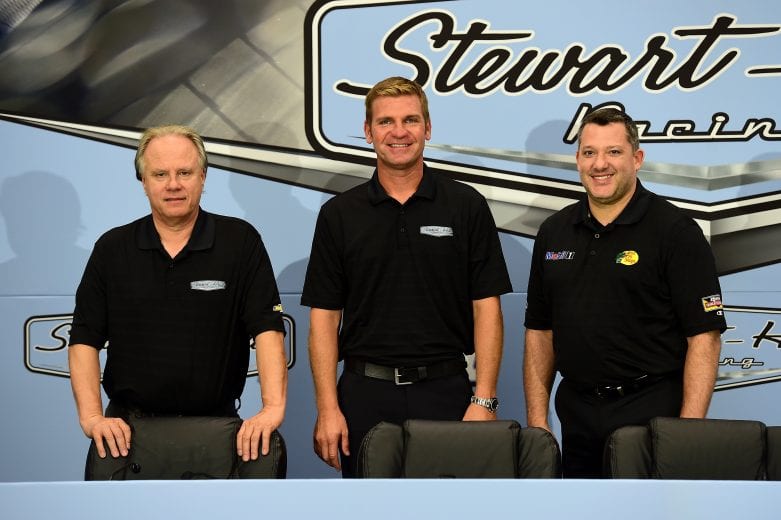 KANNAPOLIS, NC - SEPTEMBER 30:  (L-R)Gene Haas, co-owner of Stewart-Haas Racing, Clint Bowyer, newest driver for Stewart-Haas Racing, and Tony Stewart, driver of the #14 Stewart-Haas Racing Chevrolet and co-owner of Stewart-Haas Racing, pose for a photo opportunity after a press conference announcing the retirement of Stewart on September 30, 2015 in Kannapolis, North Carolina. Stewart has decided his 18th year in the NASCAR Sprint Cup Series will be his last. The three-time series champion will retire following the 2016 season, whereupon Clint Bowyer will take the wheel of the No. 14 machine beginning in 2017.  (Photo by Jared C. Tilton/Stewart-Haas Racing via Getty Images) | Getty Images