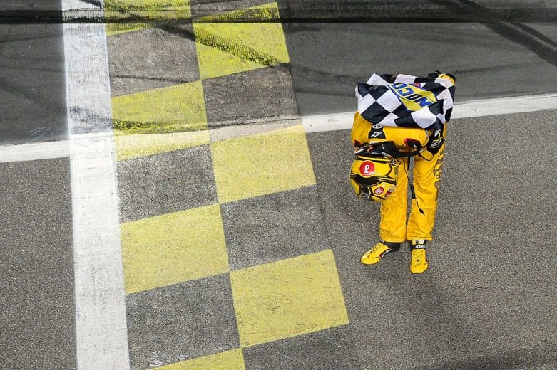 KANSAS CITY, KS - MAY 07: Kyle Busch, driver of the #18 M&M's Red Nose Toyocta, celebrates after winning the NASCAR Sprint Cup Series Go Bowling 400 at Kansas Speedway on May 7, 2016 in Kansas City, Kansas. (Photo by Robert Laberge/NASCAR via Getty Images)