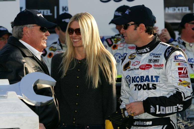 HAMPTON, GA - MARCH 18: (R-L) Jimmie Johnson, driver of the #48 Lowe's/Kobalt Tools Chevrolet, celebrates in victory lane with wife, Chandra, and car owner, Rick Hendrick after winning the NASCAR Nextel Cup Series Kobalt Tools 500 at Atlanta Motor Speedway on March 18, 2007 in Hampton, Georgia. (Photo by Chris Trotman/Getty Images for NASCAR) | Getty Images