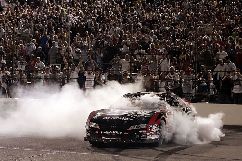 INDIANAPOLIS, IN - JULY 26: Kyle Busch, driver of the #18 Z-Line Designs Toyota, performs a burn out after winning the NASCAR Nationwide Series Kroger 200 on July 26, 2008 at O'Reilly Raceway Park in Indianapolis, Indiana. (Photo by Jason Smith/Getty Images for NASCAR) | Getty Images