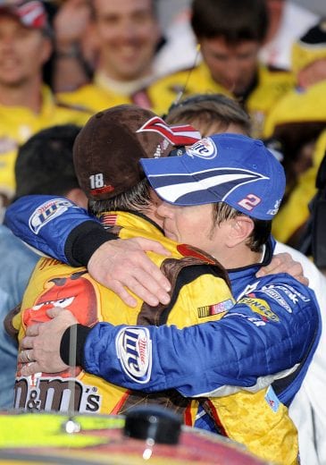 LAS VEGAS - MARCH 01: Kyle Busch, driver of the #18 M&M's Toyota, is hugged by his brother Kurt Busch, driver of the #2 Miller Lite Dodge, in victory lane after winning the NASCAR Sprint Cup Series Shelby 427 at the Las Vegas Motor Speedway on March 1, 2009 in Las Vegas, Nevada. (Photo by Rusty Jarrett/Getty Images for NASCAR) | Getty Images