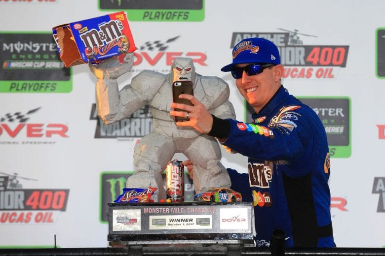 DOVER, DE - OCTOBER 01: Kyle Busch, driver of the #18 M&M's Caramel Toyota, takes a selfie in Victory Lane after winning the Monster Energy NASCAR Cup Series Apache Warrior 400 presented by Lucas Oil at Dover International Speedway on October 1, 2017 in Dover, Delaware. (Photo by Chris Trotman/Getty Images) | Getty Images