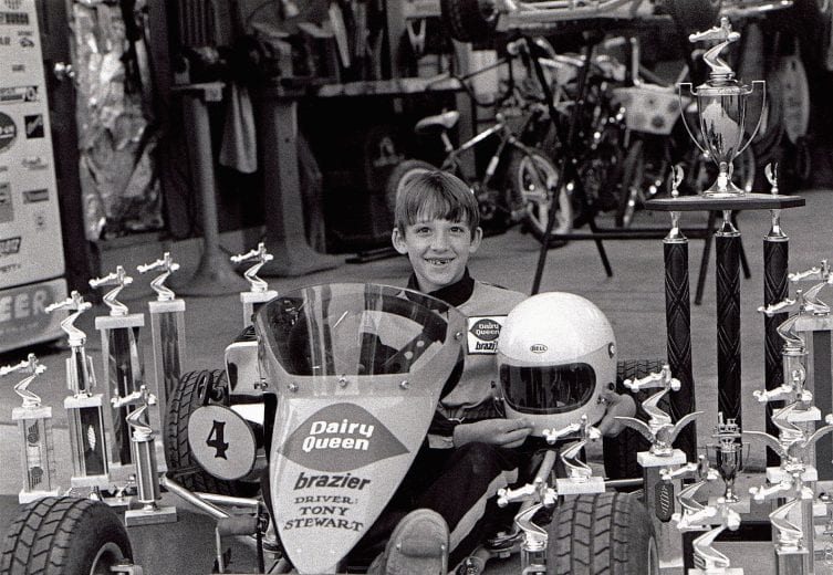COLUMBUS, IN - MAY 20:  Tony Stewart is scene here in his garage on his winning kart with 15 winning trophies.  Stewart soon moved on and raced three-quarter midgets.   (Photo by Racing Photo Archives/Getty Images)