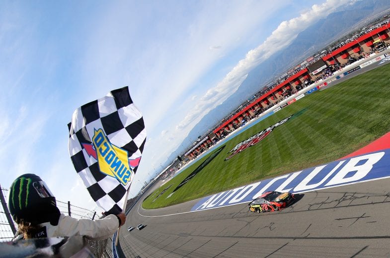 FONTANA, CA - MARCH 18:  Martin Truex Jr., driver of the #78 Bass Pro Shops/5-hour ENERGY Toyota, takes the checkered flag to win the Monster Energy NASCAR Cup Series Auto Club 400 at Auto Club Speedway on March 18, 2018 in Fontana, California.  (Photo by Jonathan Ferrey/Getty Images) | Getty Images