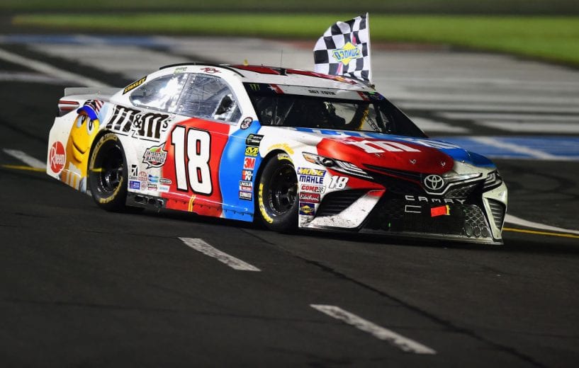 CHARLOTTE, NC - MAY 27: Kyle Busch, driver of the #18 M&M's Red White & Blue Toyota, celebrates with the checkered flag after winning the Monster Energy NASCAR Cup Series Coca-Cola 600 at Charlotte Motor Speedway on May 27, 2018 in Charlotte, North Carolina. (Photo by Jared C. Tilton/Getty Images) | Getty Images