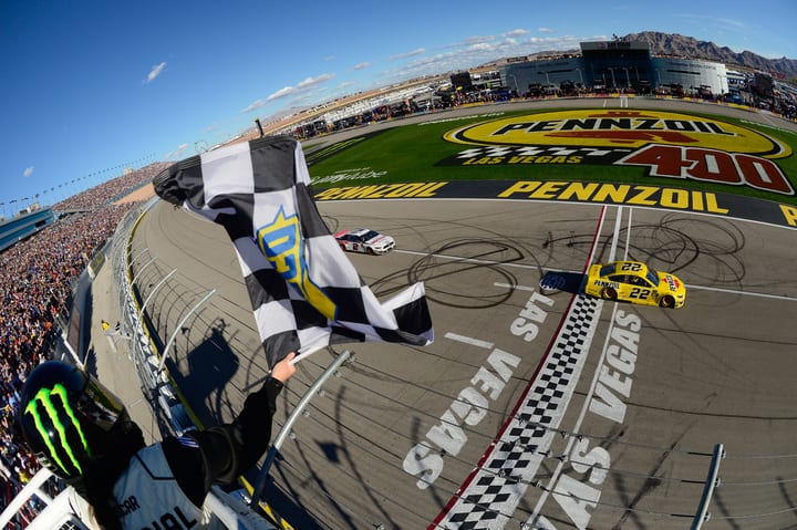 Joey Logano crosses finish line ahead of Brad Keselowski