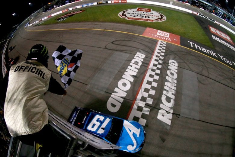 RICHMOND, VA - APRIL 13: Martin Truex Jr, driver of the #19 Auto Owners Insurance Toyota, takes the checkered flag to win the Monster Energy NASCAR Cup Series Toyota Owners 400 at Richmond Raceway on April 13, 2019 in Richmond, Virginia. (Photo by Sean Gardner/Getty Images) | Getty Images