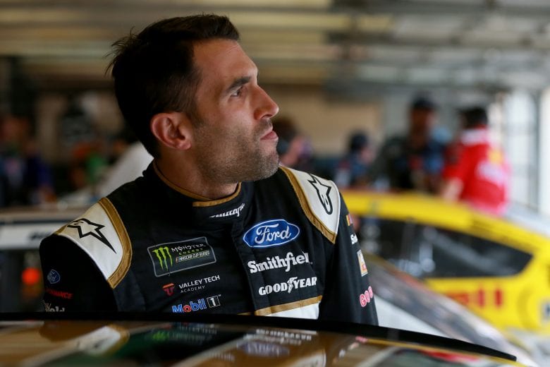 FORT WORTH, TX - MARCH 29: Aric Almirola, driver of the #10 Smithfield Prime Fresh Ford, stands in the garage during practice for the Monster Energy NASCAR Cup Series O'Reilly Auto Parts 500 at Texas Motor Speedway on March 29, 2019 in Fort Worth, Texas. (Photo by Sean Gardner/Getty Images) | Getty Images