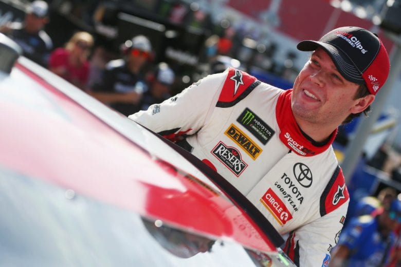 BRISTOL, TN - AUGUST 17: Erik Jones, driver of the #20 Sport Clips Toyota, stands by his car during qualifying for the Monster Energy NASCAR Cup Series Bass Pro Shops NRA Night Race at Bristol Motor Speedway on August 17, 2018 in Bristol, Tennessee. (Photo by Sarah Crabill/Getty Images) | Getty Images