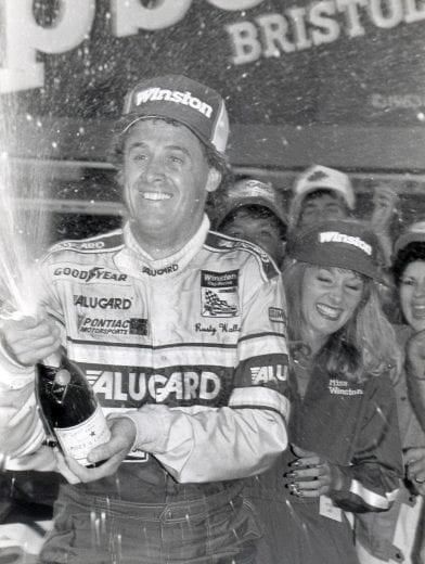 BRISTOL, TN - APRIL 6: Rusty Wallace celebrates in Victory Lane after winning the Valleydale 500 on April 20, 1986 in Bristol, Temmessee. Wallace would take home $34,760 for the race. (Photo by Racing Photo Archives/Getty Images)
