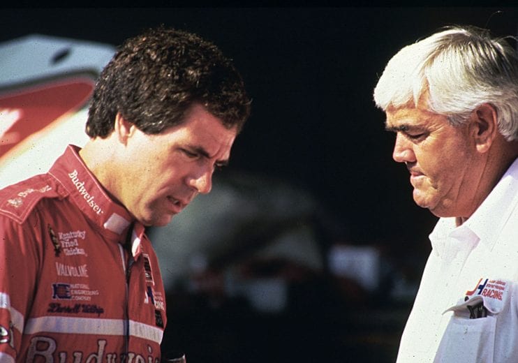 1984: Driver Darrell Waltrip and car owner Junior Johnson go over a few points before a NASCAR Cup race at Talladega Superspeedway. (Photo by ISC Images & Archives via Getty Images)