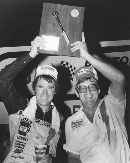 BRISTOL, TN - AUGUST 25, 1979:  Crew chief Buddy Parrott celebrates with driver Darrell Waltrip after they won the Volunteer 500 NASCAR Cup race at Bristol International Speedway. Waltrip drove a Chevrolet Monte Carlo he had nicknamed ÒBertha.Ó (Photo by ISC Images & Archives via Getty Images)