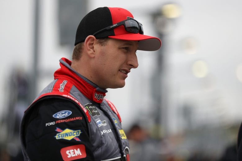 HAMPTON, GA - FEBRUARY 22:  Michael McDowell, driver of the #34 FR8 Auctions Ford, stands on the grid during qualifying for the Monster Energy NASCAR Cup Series Folds of Honor Quiktrip 500 at Atlanta Motor Speedway on February 22, 2019 in Hampton, Georgia.  (Photo by Chris Graythen/Getty Images) | Getty Images