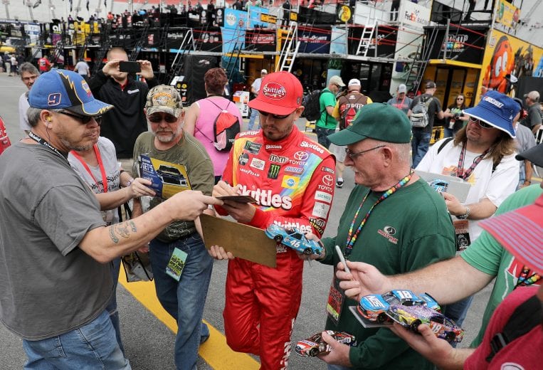 BRISTOL, TN - APRIL 05: Kyle Busch, driver of the #18 Skittles Toyota, signs autographs for fans during practice for the Monster Energy NASCAR Cup Series Food City 500 at Bristol Motor Speedway on April 5, 2019 in Bristol, Tennessee. (Photo by Donald Page/Getty Images) | Getty Images