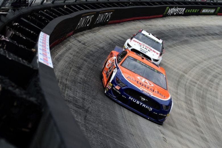 BRISTOL, TN - APRIL 07: Joey Logano, driver of the #22 Autotrader Ford, leads Brad Keselowski, driver of the #2 Discount Tire Ford, during the Monster Energy NASCAR Cup Series Food City 500 at Bristol Motor Speedway on April 7, 2019 in Bristol, Tennessee. (Photo by Jared C. Tilton/Getty Images) | Getty Images