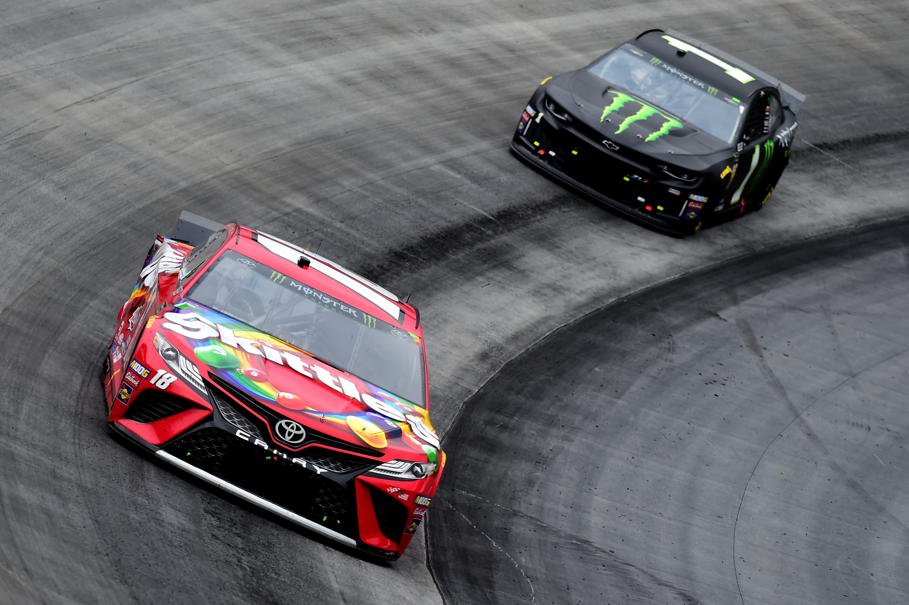 BRISTOL, TN - APRIL 07:  Kyle Busch, driver of the #18 Skittles Toyota, leads Kurt Busch, driver of the #1 Monster Energy Chevrolet, during the Monster Energy NASCAR Cup Series Food City 500 at Bristol Motor Speedway on April 7, 2019 in Bristol, Tennessee.  (Photo by Jared C. Tilton/Getty Images) | Getty Images